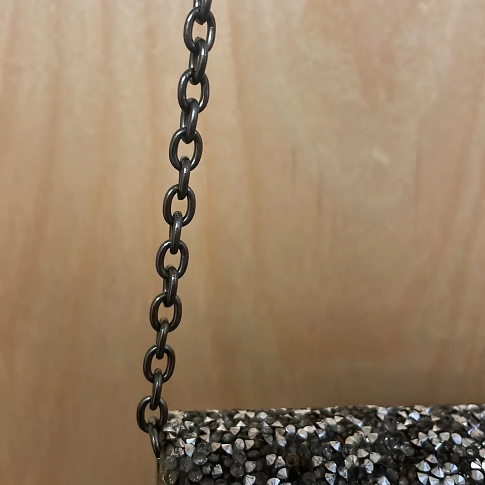 Saks Fifth Avenue sparkly gemstones clutch with chain link strap.